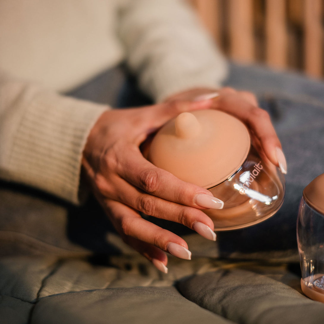 Hands holding Emulait Anatomy Bottle