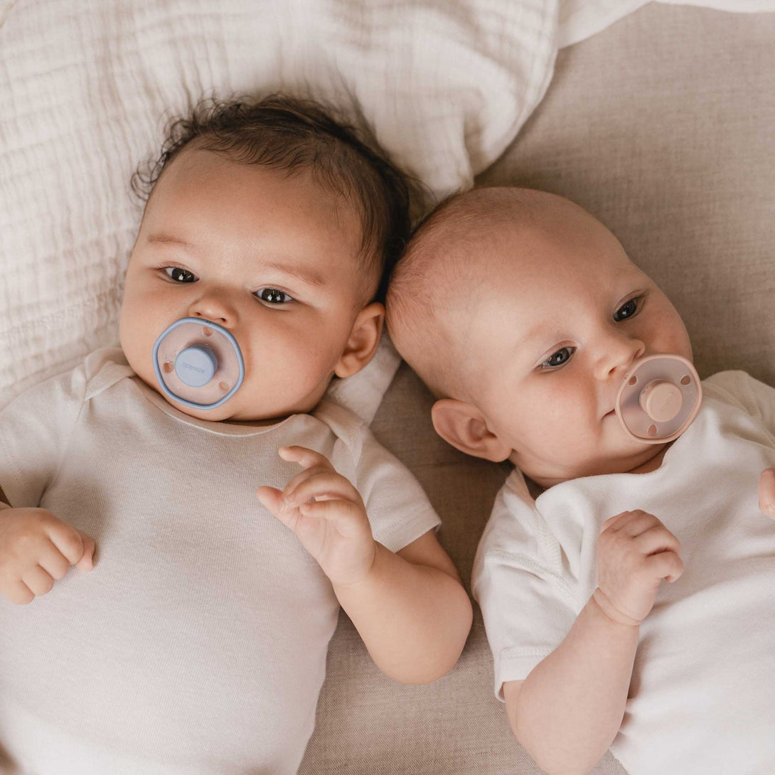 Two Babies with Rose and Blu Emulait Pacifier